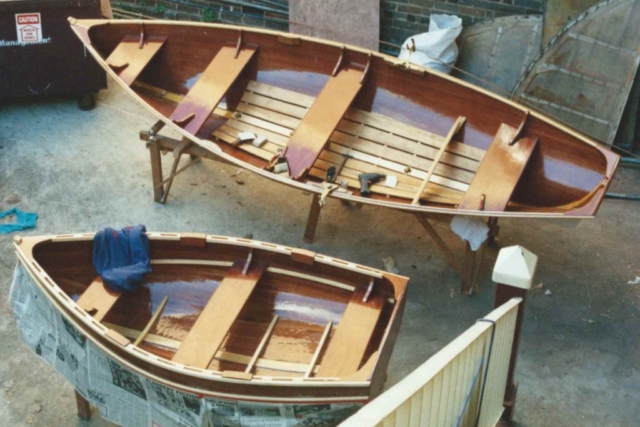 Strip-built Pippy and Fisher Skiff being finished off